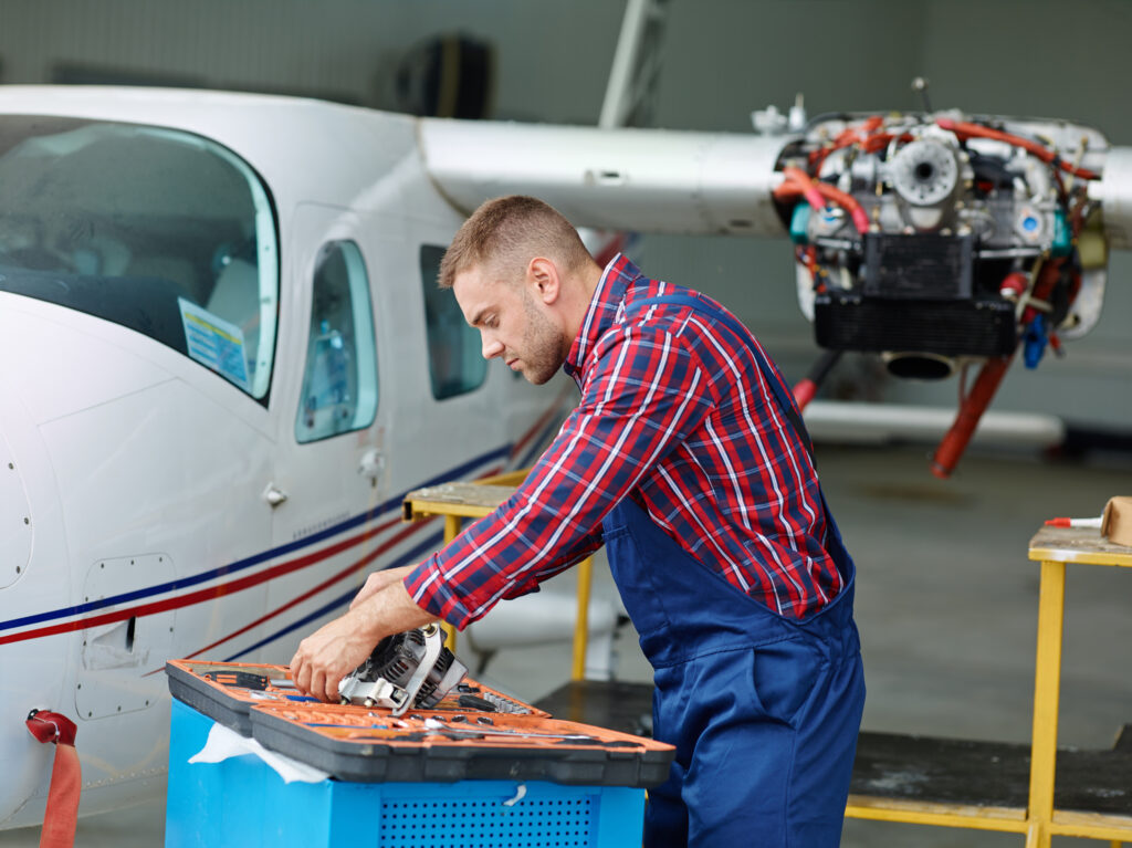 Technician taking out necessary tool from tool-box